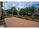 Spacious wood deck perfect for outdoor entertaining with bench seating and mature trees for privacy at 4032 Duran Ln, Auburn, GA 30011