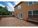 Home backyard featuring a spacious deck and lush greenery at 4032 Duran Ln, Auburn, GA 30011