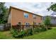Large backyard featuring a deck and garden with lots of green foliage at 4032 Duran Ln, Auburn, GA 30011
