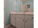 Bathroom featuring light blue walls and a white vanity for a fresh look at 4032 Duran Ln, Auburn, GA 30011