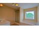 Bright bathroom showcasing a walk-in shower, soaking tub, and a window letting in natural light at 4032 Duran Ln, Auburn, GA 30011