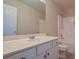 Bathroom features a white vanity, large mirror, and a shower-tub combination at 4032 Duran Ln, Auburn, GA 30011