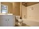 Bathroom featuring a tub and shower combination, vanity with sink and toilet at 4032 Duran Ln, Auburn, GA 30011