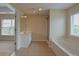 Bathroom featuring a large window, vanity with sink, shower, and tub at 4032 Duran Ln, Auburn, GA 30011