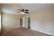 Spacious bedroom features a ceiling fan and neutral-toned walls at 4032 Duran Ln, Auburn, GA 30011