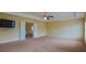 Spacious bedroom with a ceiling fan and ample natural light, ready for personalized touches at 4032 Duran Ln, Auburn, GA 30011