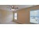 Bedroom features windows allowing ample natural light and a ceiling fan at 4032 Duran Ln, Auburn, GA 30011