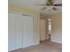 Bedroom with closet and hallway access, offering a comfortable and functional layout at 4032 Duran Ln, Auburn, GA 30011