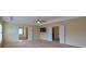 Large bedroom with a ceiling fan, and access to both the bathroom and hallway at 4032 Duran Ln, Auburn, GA 30011