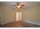 Bedroom with ceiling fan and adjoining rooms, offering flexibility at 4032 Duran Ln, Auburn, GA 30011