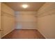 Walk-in closet with ample shelving, providing plenty of storage space at 4032 Duran Ln, Auburn, GA 30011