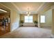 Bright dining room with decorative molding, a chandelier, and natural light at 4032 Duran Ln, Auburn, GA 30011