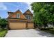 Charming two-story home with a well-manicured lawn and a spacious two-car garage at 4032 Duran Ln, Auburn, GA 30011