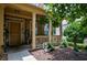 Inviting front porch with decorative plants and a welcome sign creates a warm and welcoming entrance at 4032 Duran Ln, Auburn, GA 30011