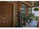 Cozy front porch featuring decorative plants and a rustic 'WELCOME' sign at 4032 Duran Ln, Auburn, GA 30011