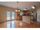Bright kitchen features stainless steel appliances, wood cabinets, and stone countertops at 4032 Duran Ln, Auburn, GA 30011