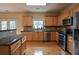 Spacious kitchen featuring stainless steel appliances, hardwood floors and a view to the back yard at 4032 Duran Ln, Auburn, GA 30011