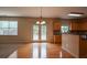 Bright kitchen features stainless steel appliances, wood cabinets, and stone countertops at 4032 Duran Ln, Auburn, GA 30011