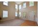 Bright, open living room with soaring ceilings and large windows allowing ample natural light at 4032 Duran Ln, Auburn, GA 30011