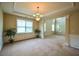 Open-concept living and dining area with natural light and elegant trim work at 4032 Duran Ln, Auburn, GA 30011