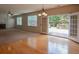 Open-concept living area with fireplace, built-ins, and bright windows offering a seamless flow to the outdoors at 4032 Duran Ln, Auburn, GA 30011
