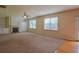 Spacious living room features a fireplace, built-in shelving, and large windows that flood the space with light at 4032 Duran Ln, Auburn, GA 30011
