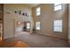 Open-concept living room with high ceilings and large windows at 4032 Duran Ln, Auburn, GA 30011