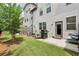 Backyard with patio, grill and green space at 8215 Harlond Way, Suwanee, GA 30024
