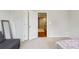 Bedroom with open door and open closet at 8215 Harlond Way, Suwanee, GA 30024