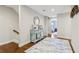 Inviting hallway with stylish decor, a mirror, and an area rug at 8215 Harlond Way, Suwanee, GA 30024