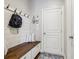 Functional mudroom with bench seating, storage, and convenient access to the home's interior at 8215 Harlond Way, Suwanee, GA 30024