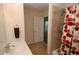 This bathroom features a shower-tub, a white vanity, and a neutral color scheme at 1000 Silver Summit Se Dr, Conyers, GA 30094