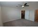 Bedroom with carpeted floors, ceiling fan, and white walls featuring neutral color palette and ample space at 1000 Silver Summit Se Dr, Conyers, GA 30094