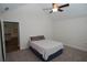 Bedroom featuring a bed, neutral carpet, and a view into the kitchen showcasing comfort and convenience at 1000 Silver Summit Se Dr, Conyers, GA 30094