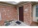 Close-up of the front door, showcasing brick exterior and attractive entryway at 1000 Silver Summit Se Dr, Conyers, GA 30094