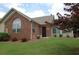 Charming brick home with a well-manicured lawn and mature landscaping at 1000 Silver Summit Se Dr, Conyers, GA 30094