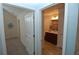 Hallway featuring doorways into a bedroom and a bathroom, showcasing the layout of the home at 1000 Silver Summit Se Dr, Conyers, GA 30094