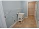 Functional laundry room with utility sink, shelving, and ample space for storage and laundry tasks at 1000 Silver Summit Se Dr, Conyers, GA 30094