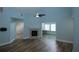 Spacious living room with fireplace and view to an adjacent room at 1000 Silver Summit Se Dr, Conyers, GA 30094