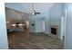 Open-concept living room with fireplace and view of the modern kitchen at 1000 Silver Summit Se Dr, Conyers, GA 30094