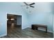 Home office space with wood-look floors, desk and view of the kitchen at 1000 Silver Summit Se Dr, Conyers, GA 30094