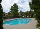 Outdoor swimming pool surrounded by a fence with lounge chairs and trees at 1000 Silver Summit Se Dr, Conyers, GA 30094