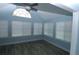 Light-filled sunroom with multiple windows and modern flooring at 1000 Silver Summit Se Dr, Conyers, GA 30094