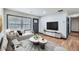 Bright living room with stylish furniture, a large window, and wood floors, perfect for entertaining at 2091 Parker Ranch Se Rd, Atlanta, GA 30316