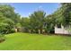 Lush backyard featuring mature trees and a green lawn at 2711 Fairlane Dr, Atlanta, GA 30340