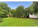 Expansive backyard featuring a large lawn and mature trees at 2711 Fairlane Dr, Atlanta, GA 30340