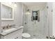 Bathroom featuring a tiled shower and granite sink at 2711 Fairlane Dr, Atlanta, GA 30340