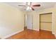 Bright bedroom features hardwood floors, closet, and a ceiling fan at 2711 Fairlane Dr, Atlanta, GA 30340