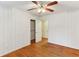 White bedroom featuring wood floors, a closet, and fresh paint at 2711 Fairlane Dr, Atlanta, GA 30340