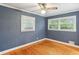 Spacious bedroom featuring hardwood floors, natural light, and a ceiling fan at 2711 Fairlane Dr, Atlanta, GA 30340